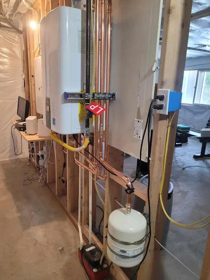 Licensed plumber repairing a kitchen sink in Fryeburg